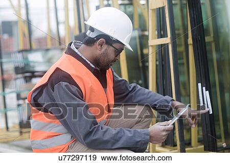 Civil engineer working at site View Large Photo Image Stock Photo - Civil engineer working at site. Fotosearch