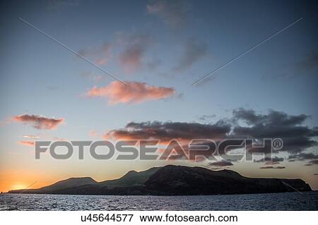 Stock Photo - Clarion Island at sunset, Socorro, Baja California. Fotosearch