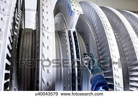 Close up of engineer working on high pressure steam turbine in turbine maintenance factory View Large Photo Image Stock Photo - Close up of engineer working on high pressure steam turbine in turbine maintenance factory. Fotosearch
