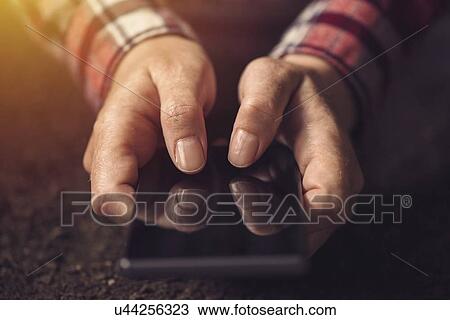 Close up of hands using mobile phone. View Large Photo Image Stock Image - Close up of hands using mobile phone.. Fotosearch