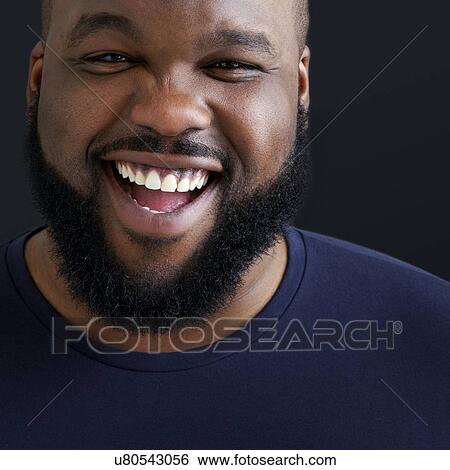 Close up of man laughing and smiling towards camera. View Large Photo Image Stock Photograph - Close up of man laughing and smiling towards camera.. Fotosearch
