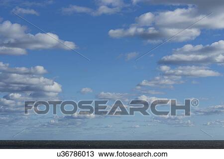 Clouds over calm sea View Large Photo Image Stock Image - Clouds over calm sea. Fotosearch