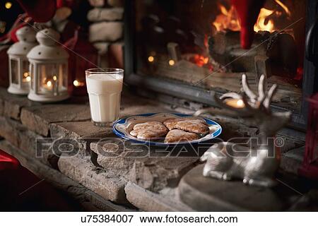 Cookies and milk, for Santa, left beside fireplace View Large Photo Image Stock Photo - Cookies and milk, for Santa, left beside fireplace. Fotosearch