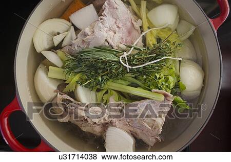 Cooking broth from turkey leftovers and vegetables View Large Photo Image Stock Photo - Cooking broth from turkey leftovers and vegetables. Fotosearch