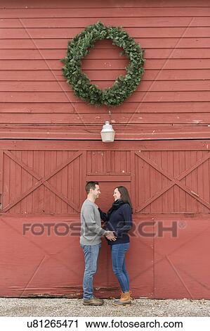 Stock Image - Couple below wreath. Fotosearch