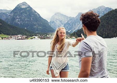 Couple by Achensee holding hands, Innsbruck, Tirol, Austria, Europe View Large Photo Image Stock Image - Couple by Achensee holding hands, Innsbruck, Tirol, Austria, Europe. Fotosearch