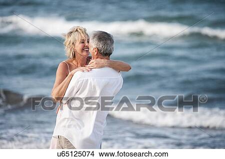 Picture - Couple hugging on beach, Palma de Mallorca, Spain. Fotosearch