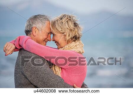 Couple hugging on beach, Palma de Mallorca, Spain View Large Photo Image Stock Photo - Couple hugging on beach, Palma de Mallorca, Spain. Fotosearch