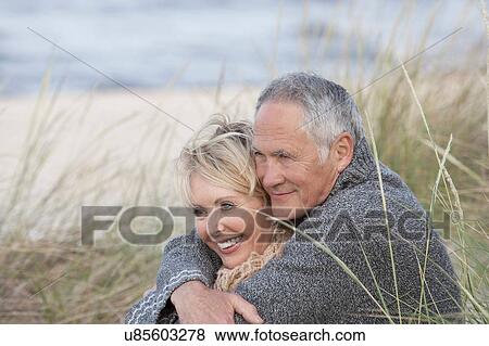 Couple hugging on beach, Palma de Mallorca, Spain View Large Photo Image Stock Photo - Couple hugging on beach, Palma de Mallorca, Spain. Fotosearch