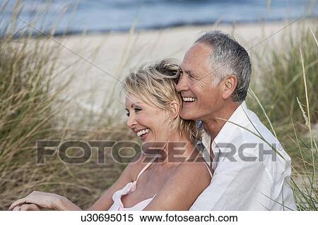 Couple hugging on beach, Palma de Mallorca, Spain View Large Photo Image Stock Photography - Couple hugging on beach, Palma de Mallorca, Spain. Fotosearch