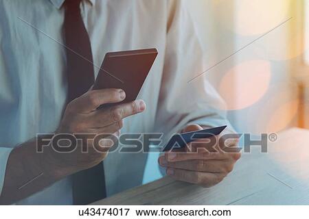Stock Photo - Credit card and mobile payment.. Fotosearch