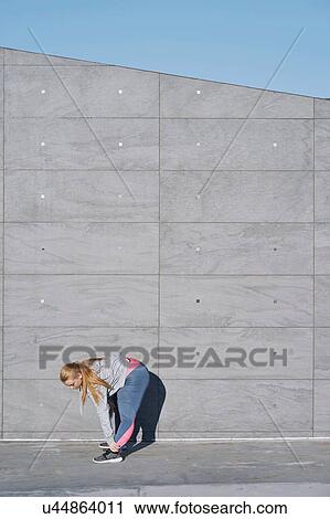 Curvaceous young woman training, touching toes View Large Photo Image Stock Image - Curvaceous young woman training, touching toes. Fotosearch