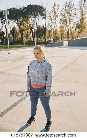 Curvaceous young woman training, standing staring View Large Photo Image Stock Photo - Curvaceous young woman training, standing staring. Fotosearch