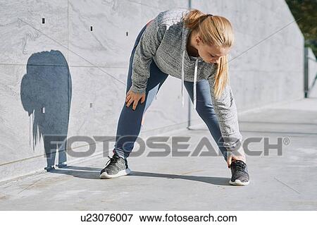 Curvaceous young woman training, touching toes View Large Photo Image Stock Photo - Curvaceous young woman training, touching toes. Fotosearch
