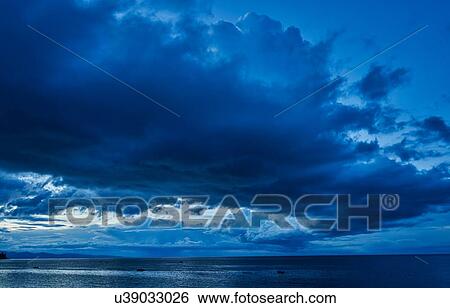 Stock Photograph - Dark clouds over lake, Copacabana, Oruro, Bolivia, South America. Fotosearch