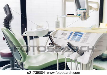 Picture - Dentist chair and equipment in dentist office. Fotosearch