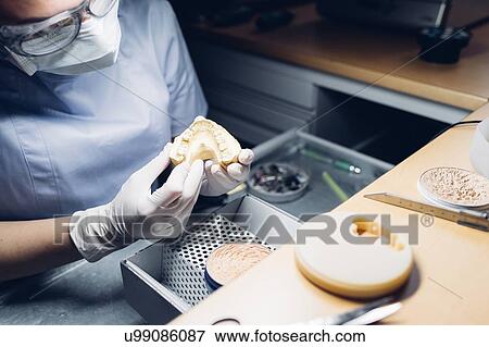 Dentist making denture in laboratory View Large Photo Image Stock Photo - Dentist making denture in laboratory. Fotosearch