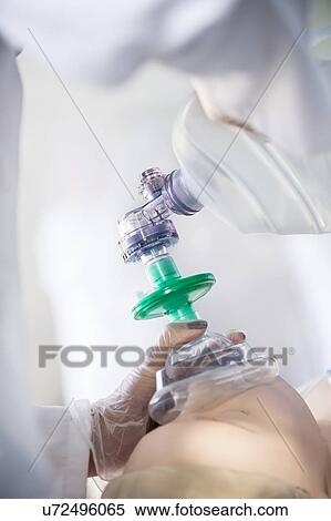 Stock Photography - Doctor practising bag-valve-mask ventilation on a training dummy.. Fotosearch