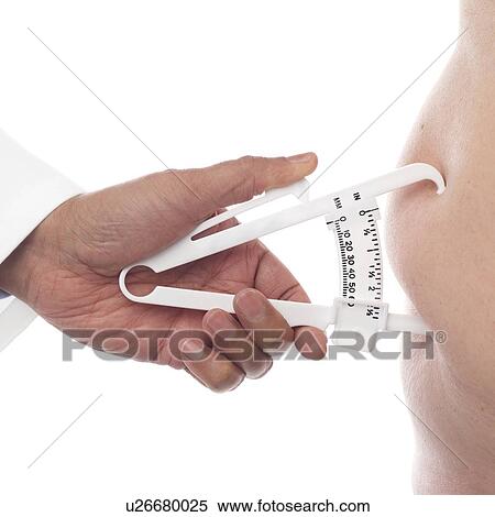 Doctor using a skin fold calliper to measure body fat. View Large Photo Image Stock Photography - Doctor using a skin fold calliper to measure body fat.. Fotosearch