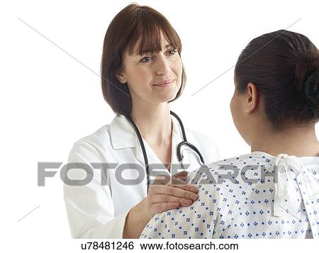 Doctor with her hand on patient's shoulder. View Large Photo Image Stock Photograph - Doctor with her hand on patient's shoulder.. Fotosearch
