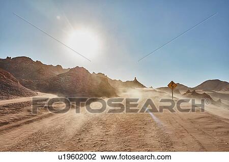 Stock Image - Dusty desert dirt track, San Pedro de Atacama, Chile. Fotosearch