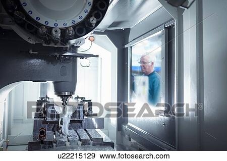 Engineer operating milling machine in precision engineering factory View Large Photo Image Stock Photo - Engineer operating milling machine in precision engineering factory. Fotosearch