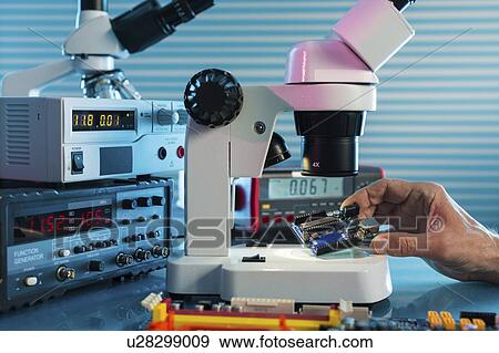 Examining circuit board with microscope. View Large Photo Image Stock Photo - Examining circuit board with microscope.. Fotosearch