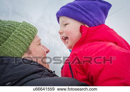 Stock Photo - Father and son in wintry weather. Fotosearch