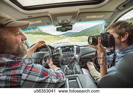 Father and son on road trip View Large Photo Image Stock Image - Father and son on road trip. Fotosearch