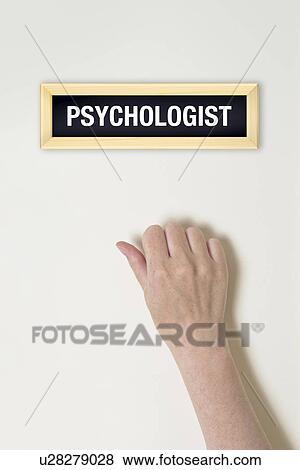 Stock Photo - Female hand knocking on psychologist's door, conceptual image.. Fotosearch