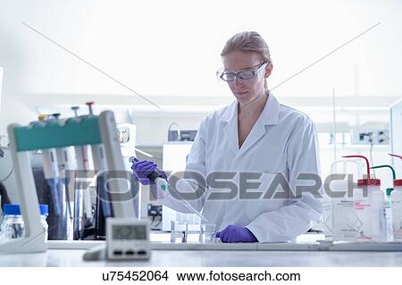 Female scientist working in laboratory View Large Photo Image Picture - Female scientist working in laboratory. Fotosearch