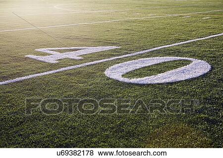 Forty yard line on green playing field View Large Photo Image Stock Photo - Forty yard line on green playing field. Fotosearch