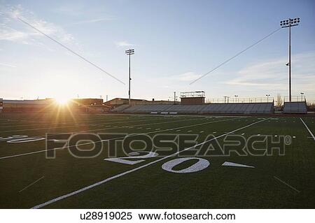Forty yard line on green playing field at sunset View Large Photo Image Stock Photography - Forty yard line on green playing field at sunset. Fotosearch