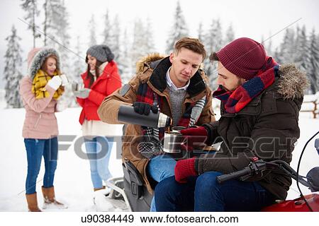 Friends having coffee outdoors in winter View Large Photo Image Stock Photo - Friends having coffee outdoors in winter. Fotosearch