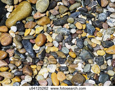 Stock Image - Full frame of colorful pebbles. Fotosearch