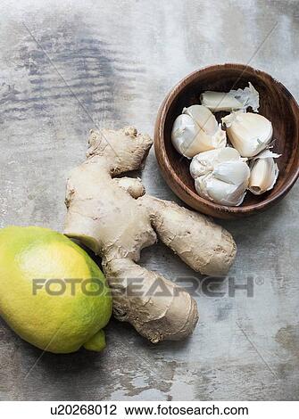 Ginger roots, lemon and garlic View Large Photo Image Stock Image - Ginger roots, lemon and garlic. Fotosearch