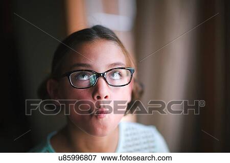 Stock Photo - Girl puckering, making faces. Fotosearch