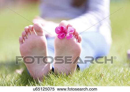 Girls' bare feet on grass. View Large Photo Image Stock Photography - Girls' bare feet on grass.. Fotosearch