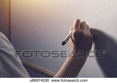 Stock Image - Hand writing on whiteboard.. Fotosearch