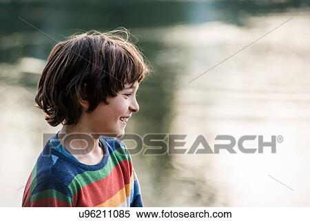 Happy boy by river, Calolziocorte, Lombardy, Italy View Large Photo Image Stock Photography - Happy boy by river, Calolziocorte, Lombardy, Italy. Fotosearch