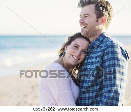 Happy couple in beach View Large Photo Image Stock Image - Happy couple in beach. Fotosearch
