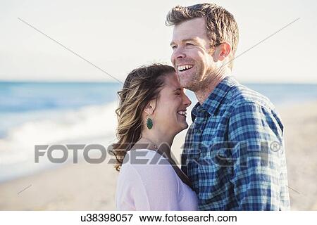 Stock Photo - Happy couple in beach. Fotosearch