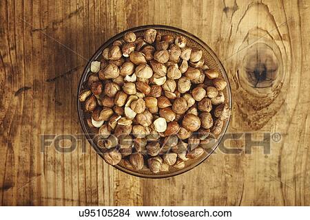 Picture - Hazelnuts in bowl.. Fotosearch