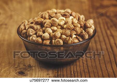 Stock Photo - Hazelnuts in bowl.. Fotosearch