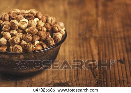 Stock Photography - Hazelnuts in bowl.. Fotosearch