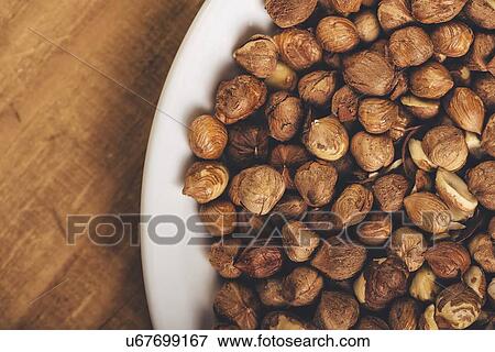 Hazelnuts on plate. View Large Photo Image Stock Photo - Hazelnuts on plate.. Fotosearch