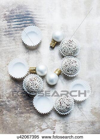 Stock Photography - Healthy truffle balls with Christmas decorations. Fotosearch