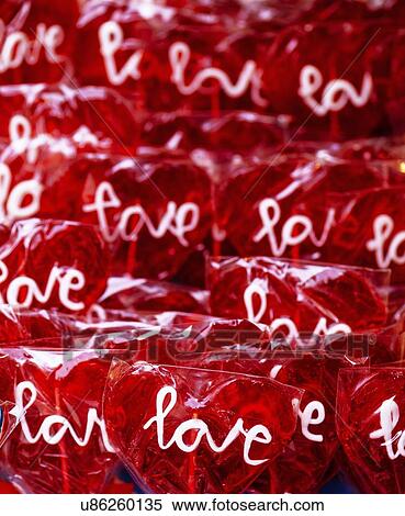 Stock Photography - Heart shaped lollipops with word Love on street market.. Fotosearch