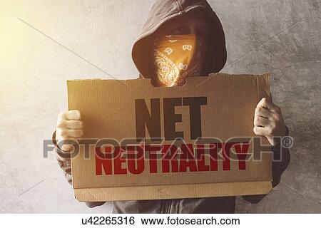 Stock Photograph - Hooded activist with Net neutrality protest sign, conceptual image.. Fotosearch