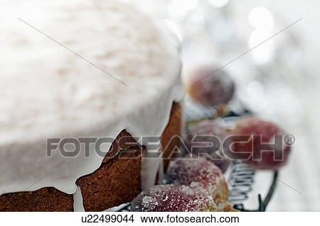 Iced cake on cake stand with sugar frosted grapes, close up View Large Photo Image Picture - Iced cake on cake stand with sugar frosted grapes, close up. Fotosearch